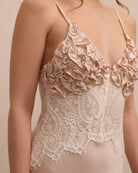 A close-up of the Robe and Nightgown Set's inner slip, focusing on the expressive ruffle detailing and lace.