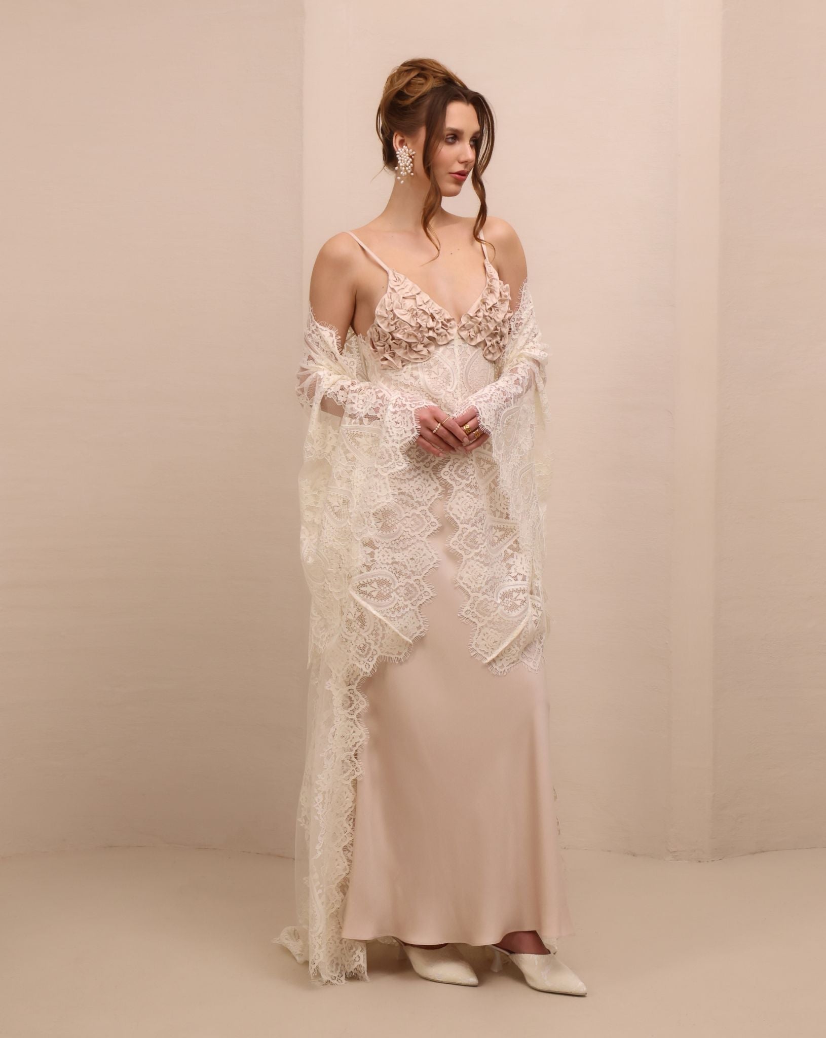 A shot of the ensemble with the robe draped over the shoulders, highlighting the sheer lace and romantic allure.