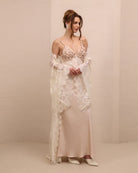 A shot of the ensemble with the robe draped over the shoulders, highlighting the sheer lace and romantic allure.