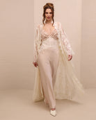 A dynamic motion shot of the Lace Robe and Nightgown Set, capturing the airy movement and the soft back train.