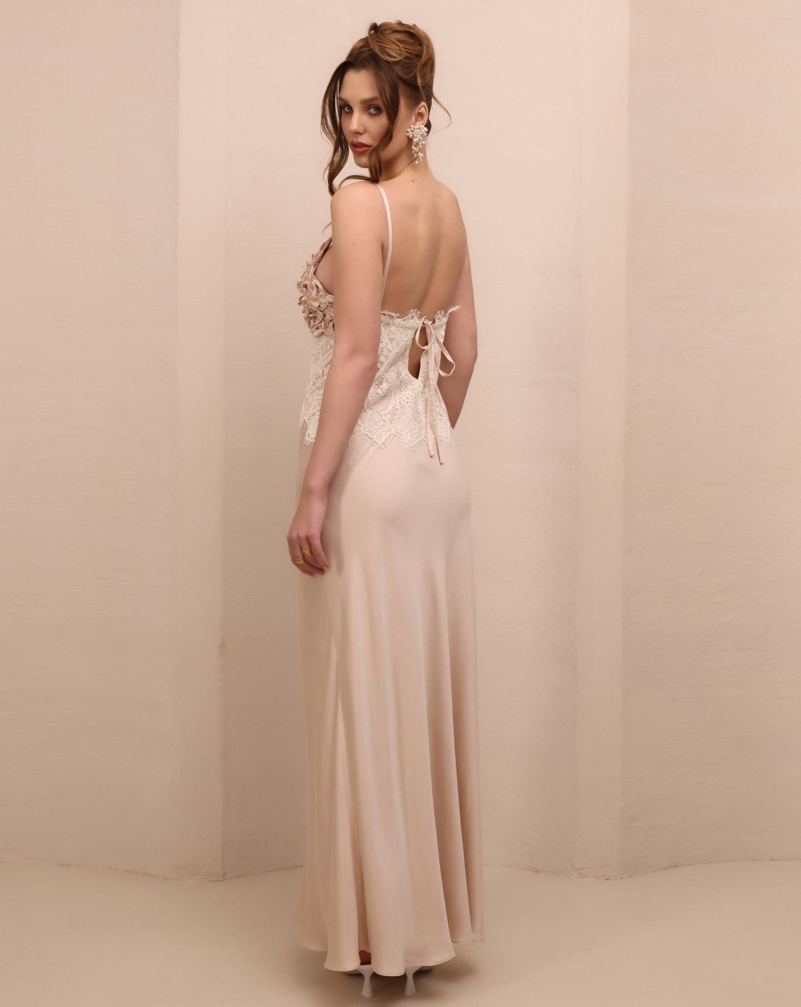 Rear view of the nightdress, highlighting the elegant tie detail and the graceful open-back effect.