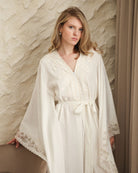 A Cotton Kaftan shown in a waist-up view, highlighting the breathable fabric and elegant high neckline.