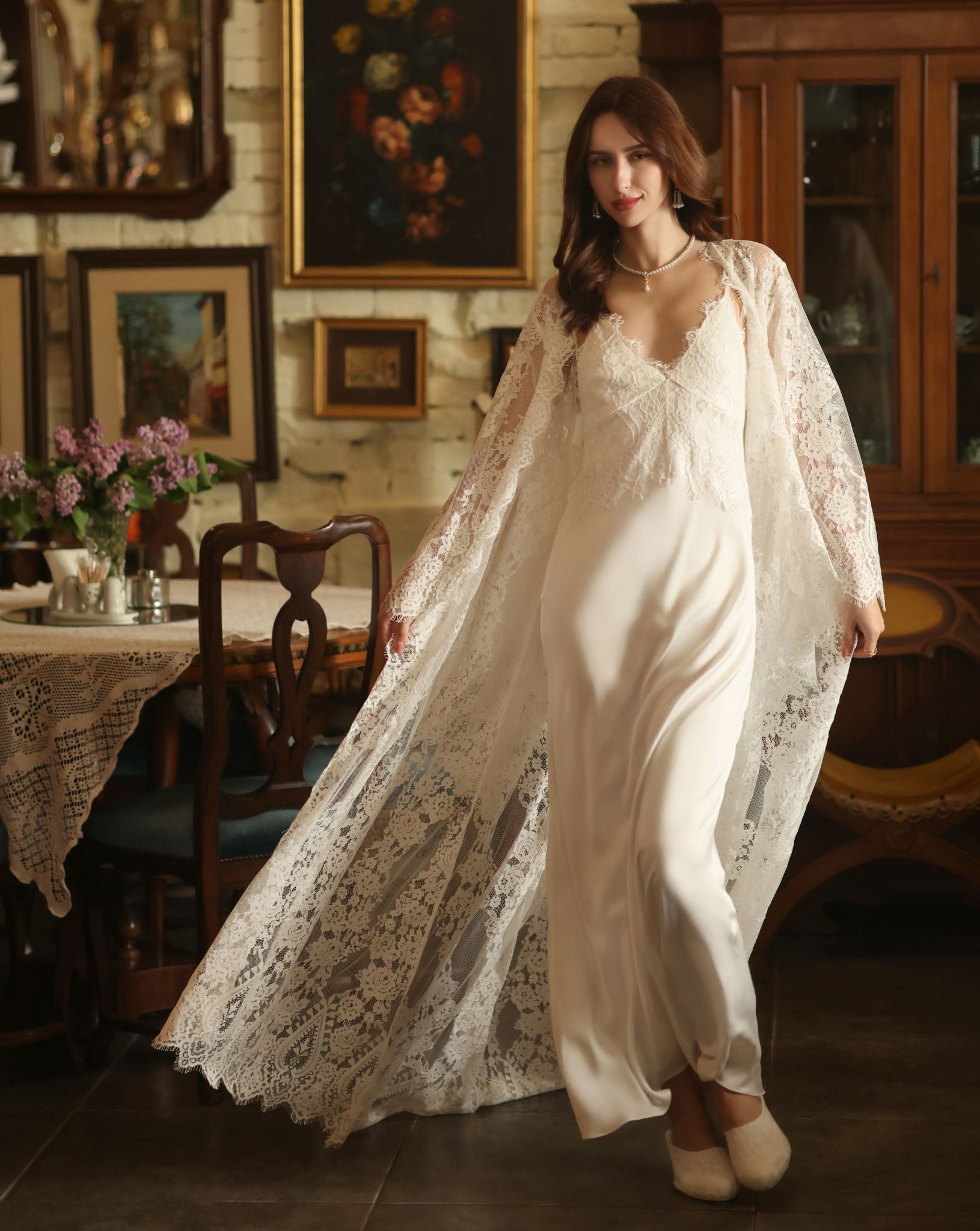 A dynamic motion shot of the Bridal Robe and Nightgown Set, capturing the fluid movement of the fabric and back train.