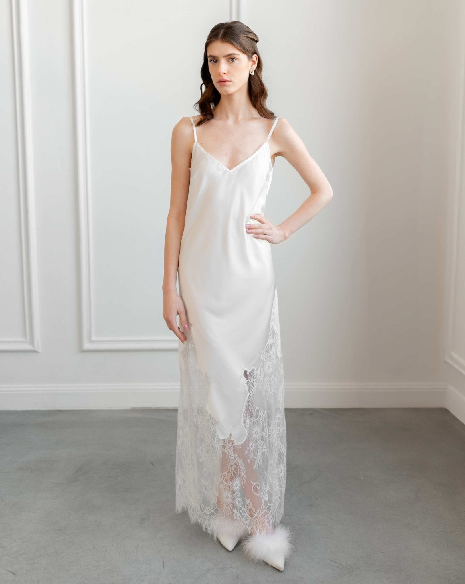 Front view of ivory satin slip dress with sheer lace hem, bridal elegance