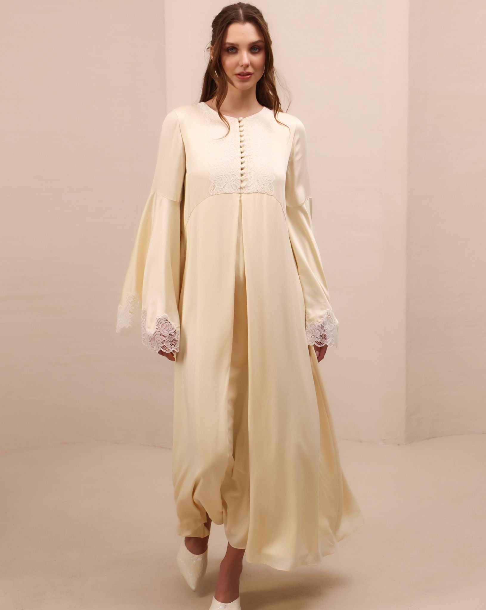 A close-up motion shot of the Modest Lounge Dress, capturing the fluid and graceful movement of the fabric.