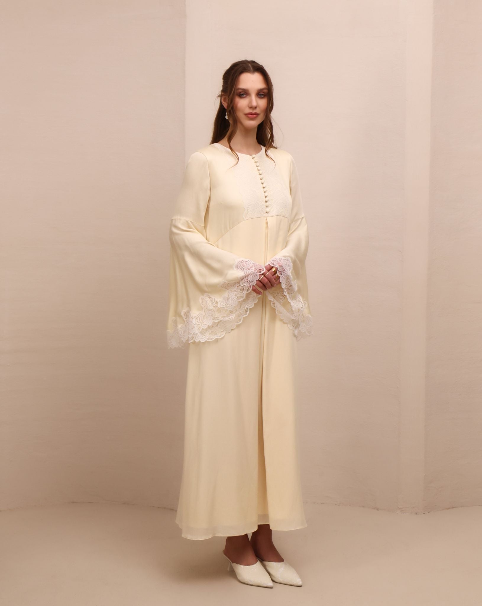 Side perspective of the attire, illustrating a beauty without restriction and a light, weightless silhouette.