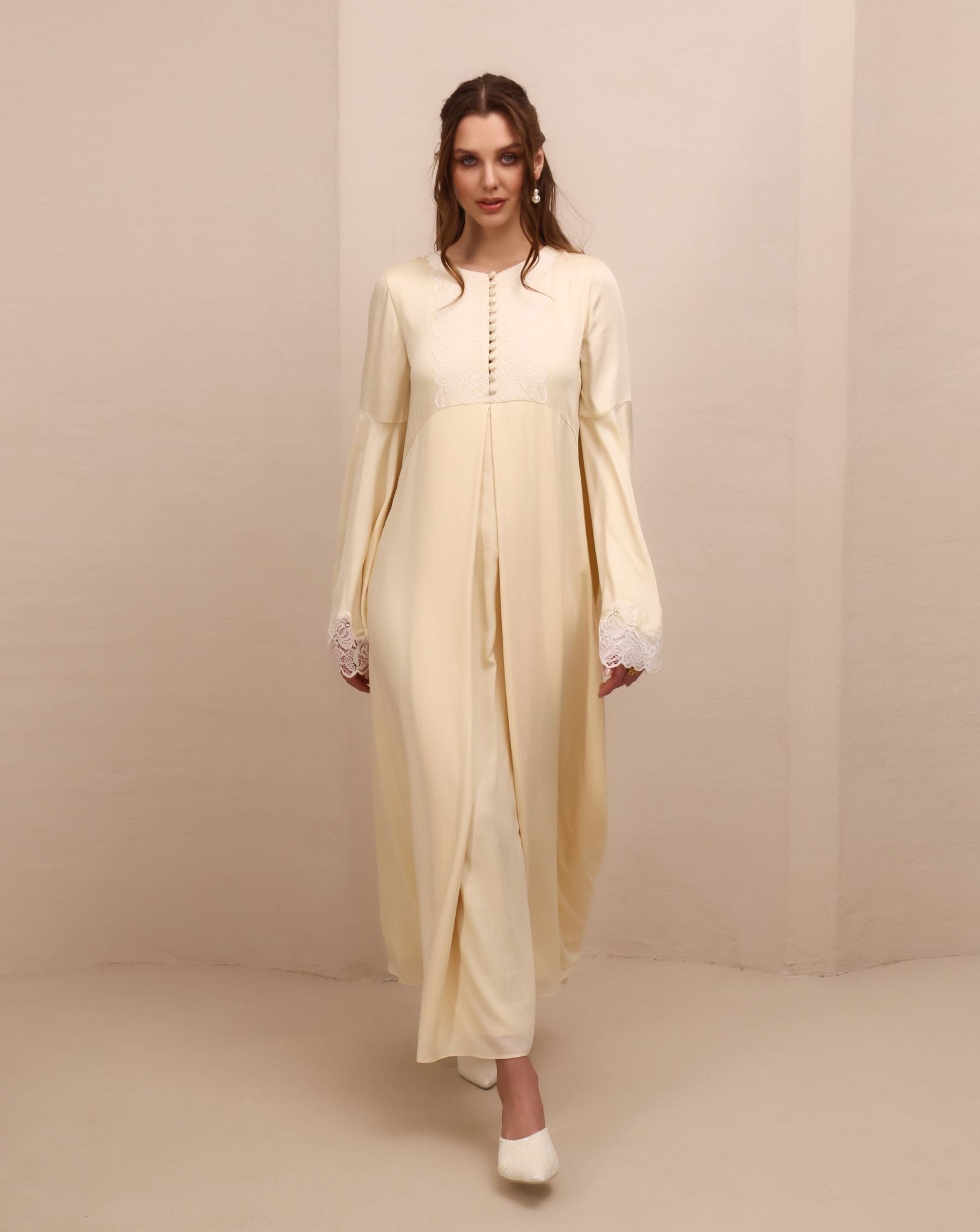 A full-length dynamic view of the flowing skirt, showing how the layered chiffon falls effortlessly to the floor.