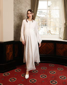 A dynamic view of the Modest Lounge Dress in motion, illustrating the fluid and weightless feel of the fabric.