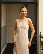 Mid-length shot of the sleeveless nightgown, showcasing the soft feminine silhouette and refined lace details.