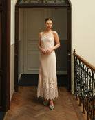 Front view of the cotton nightgown featuring delicate lace along the neckline and scattered artistic appliqués.