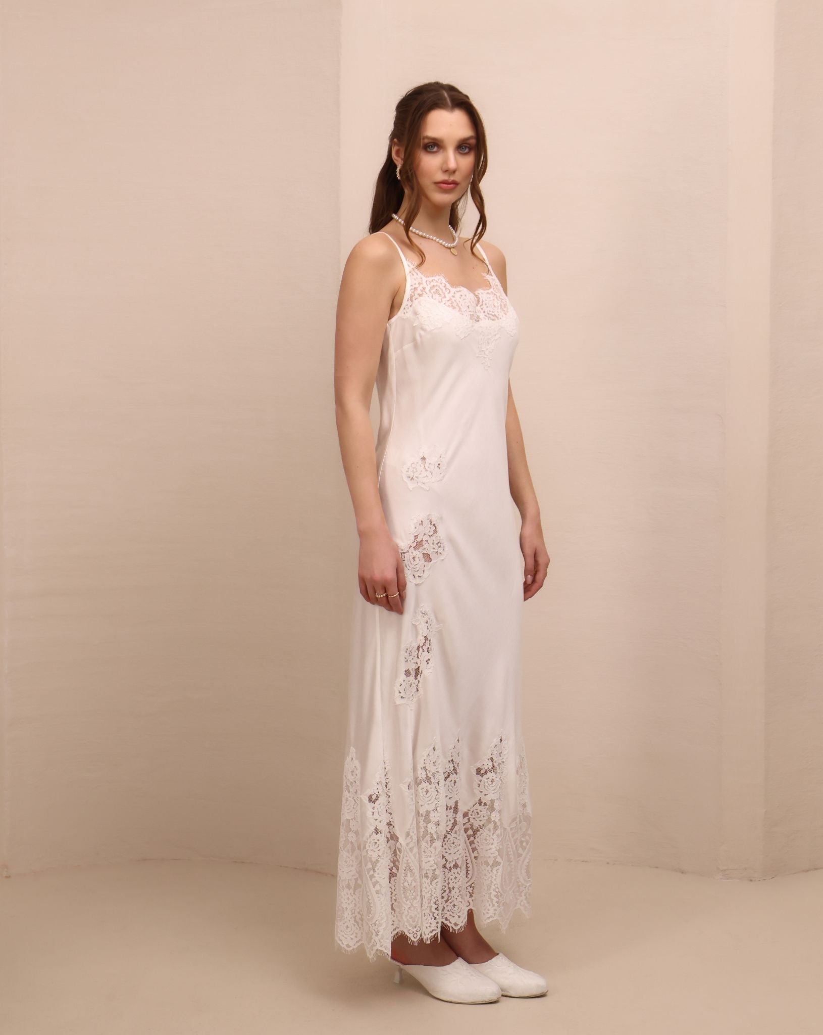 Side perspective of the nightdress, illustrating the graceful drape of the cotton-viscose blend on the body.