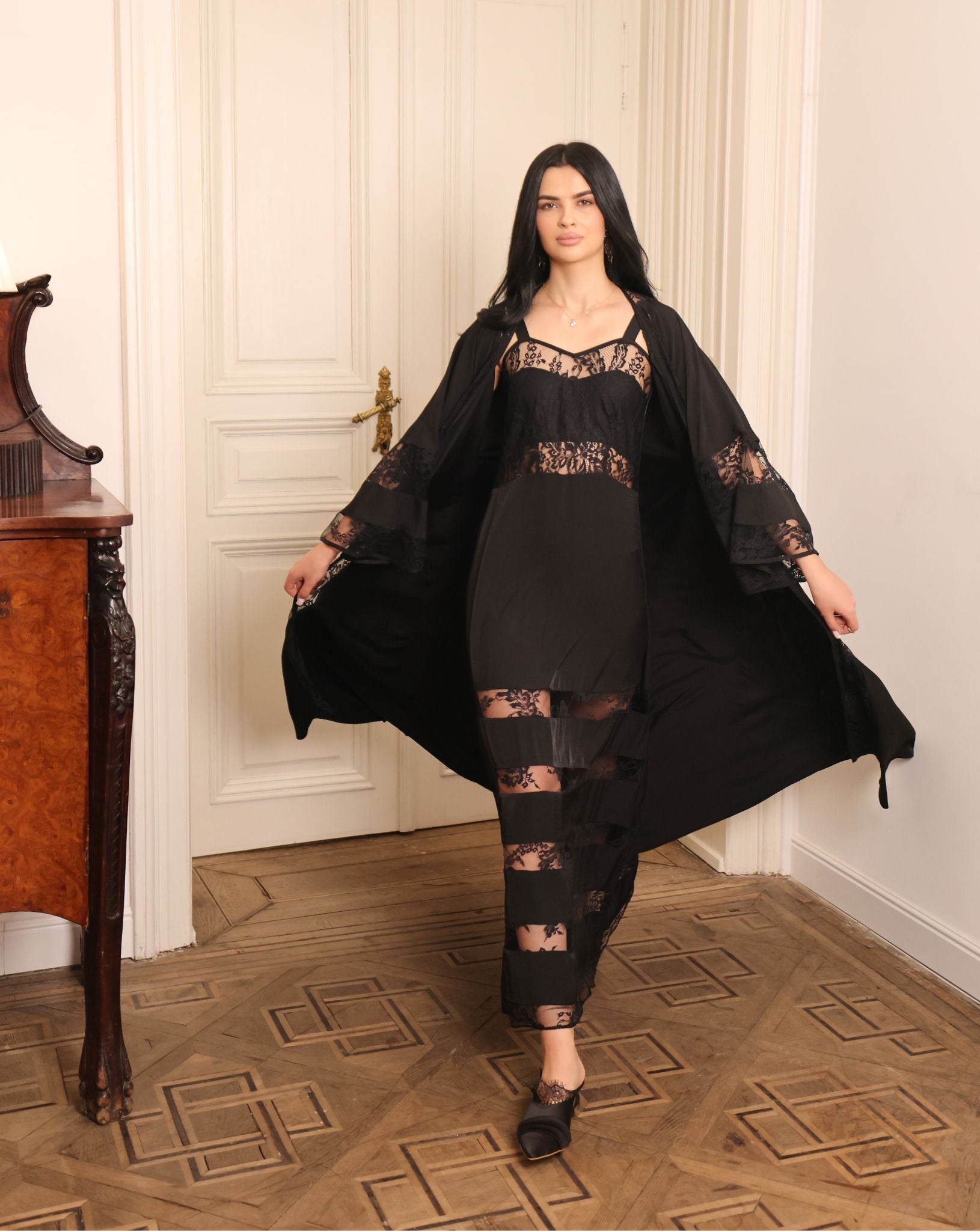 Rear motion shot of the flowing robe, illustrating the breathable 100% viscose fabric and its natural sheen.