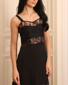 Detailed shot from head to waist, showcasing the dramatic lace inserts that add a romantic touch to the look.