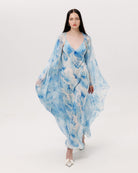 A full-length shot of the Silk Robe and Nightgown Set in motion, capturing the fluid and wave-like rhythm of pure silk.