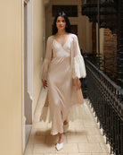 A dynamic motion shot capturing the lace trim at the hem as it adds depth and softness to every step.
