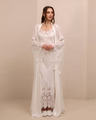 A serene static view of the open ensemble, showcasing the intricate lace along the wide, flowing sleeves.
