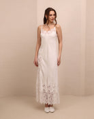 Frontal view of the nightgown featuring delicate lace detailing and adjustable shoulder straps for a perfect fit.