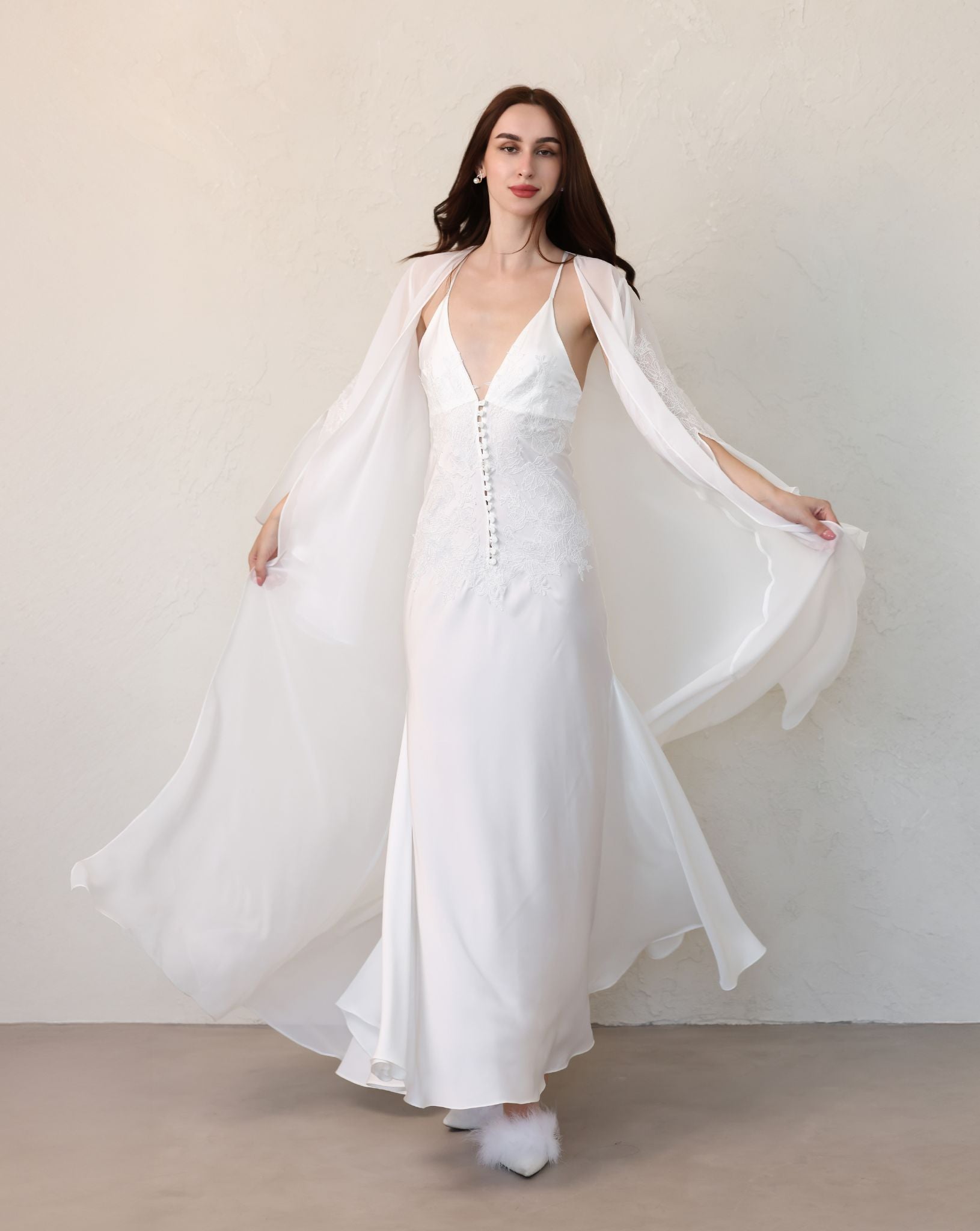 Dynamic shot of a white lace robe swirling, showcasing the lightweight polyester fabric and impressive volume.