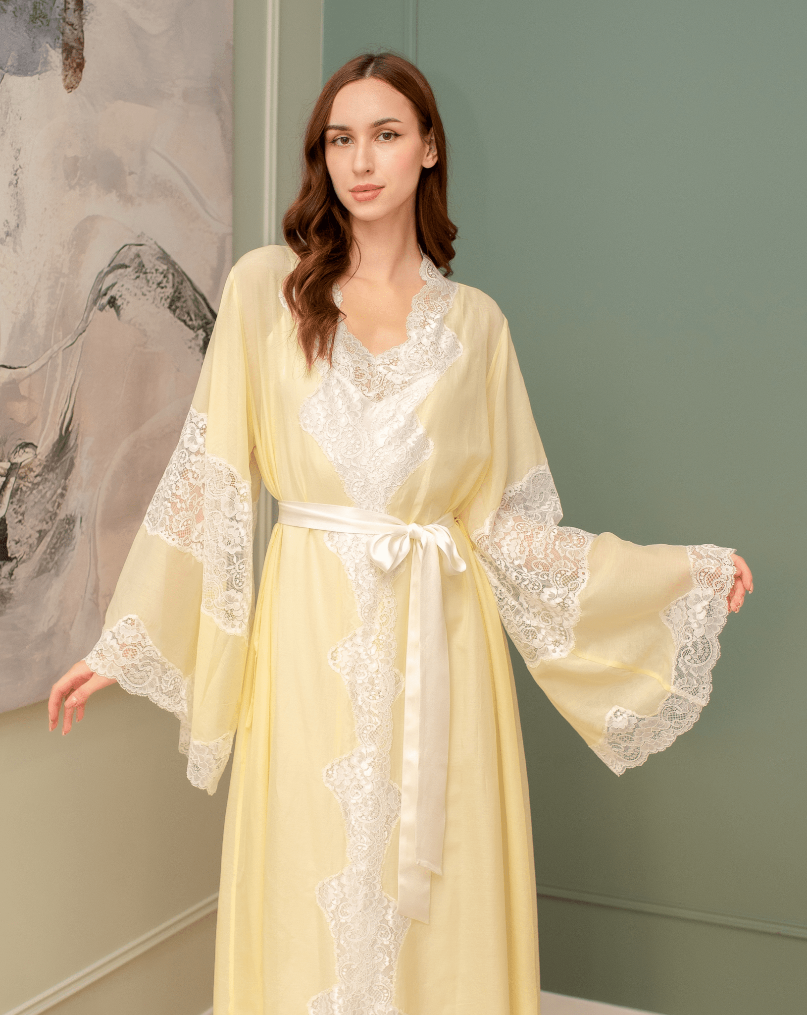 Mid-length view of the belted robe over the silk dress, creating a special atmosphere of feminine grace at home.