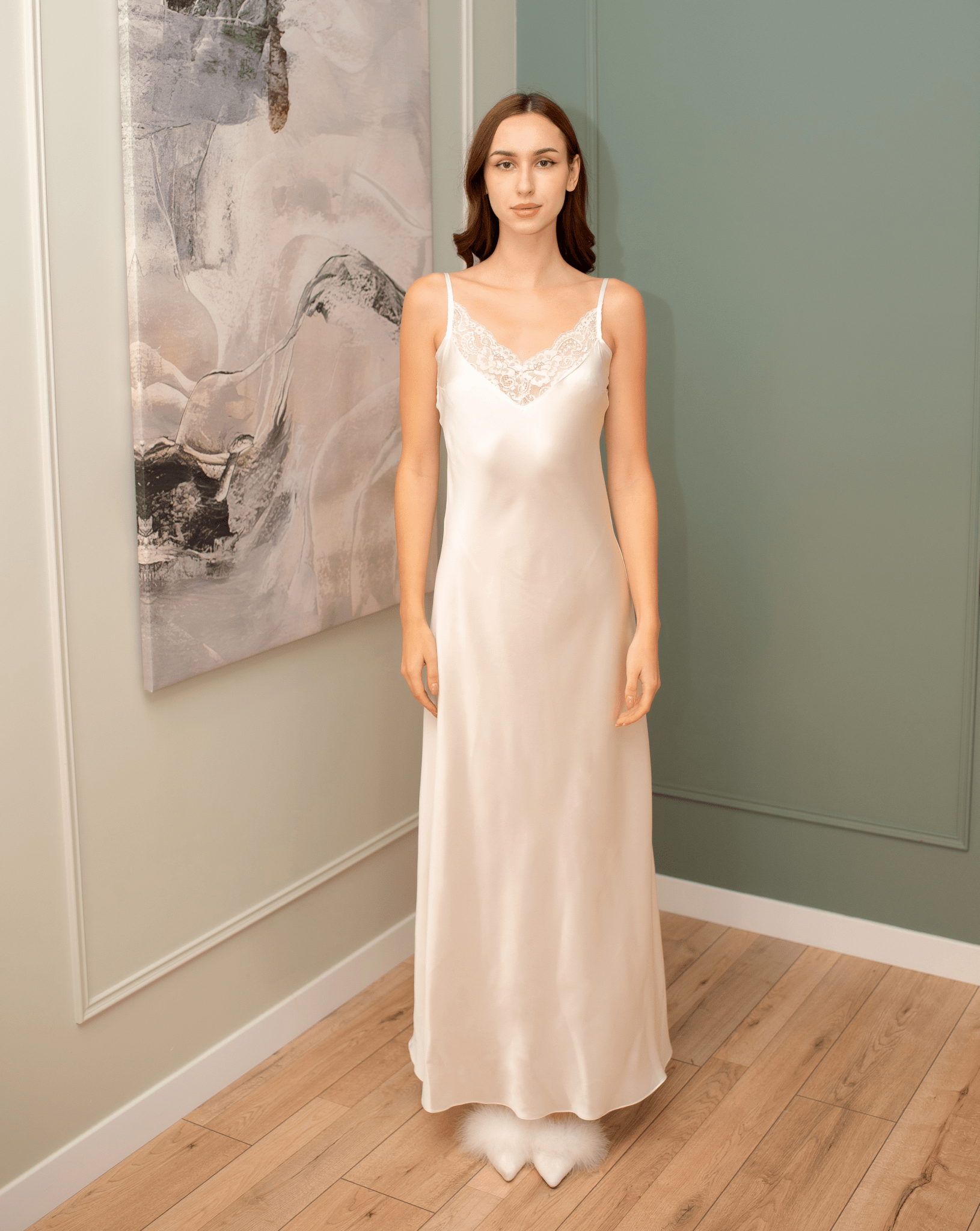 Frontal view of the 100% mulberry silk nightgown, highlighting the delicate lace embellishment and shoulder straps.