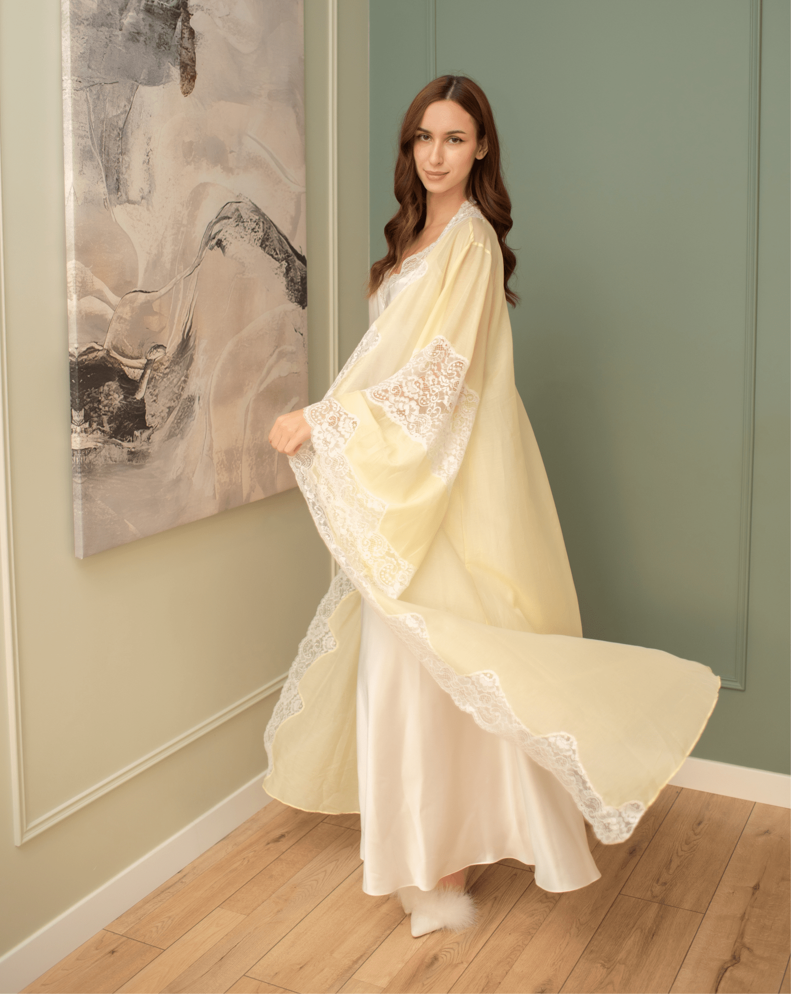 A dynamic shot of the ensemble in motion, capturing the flowing chiffon robe as it moves silently with every step.