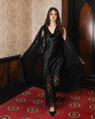 Motion shot of the layered set, illustrating the fluid definition of the silk sash and the movement of the lace.