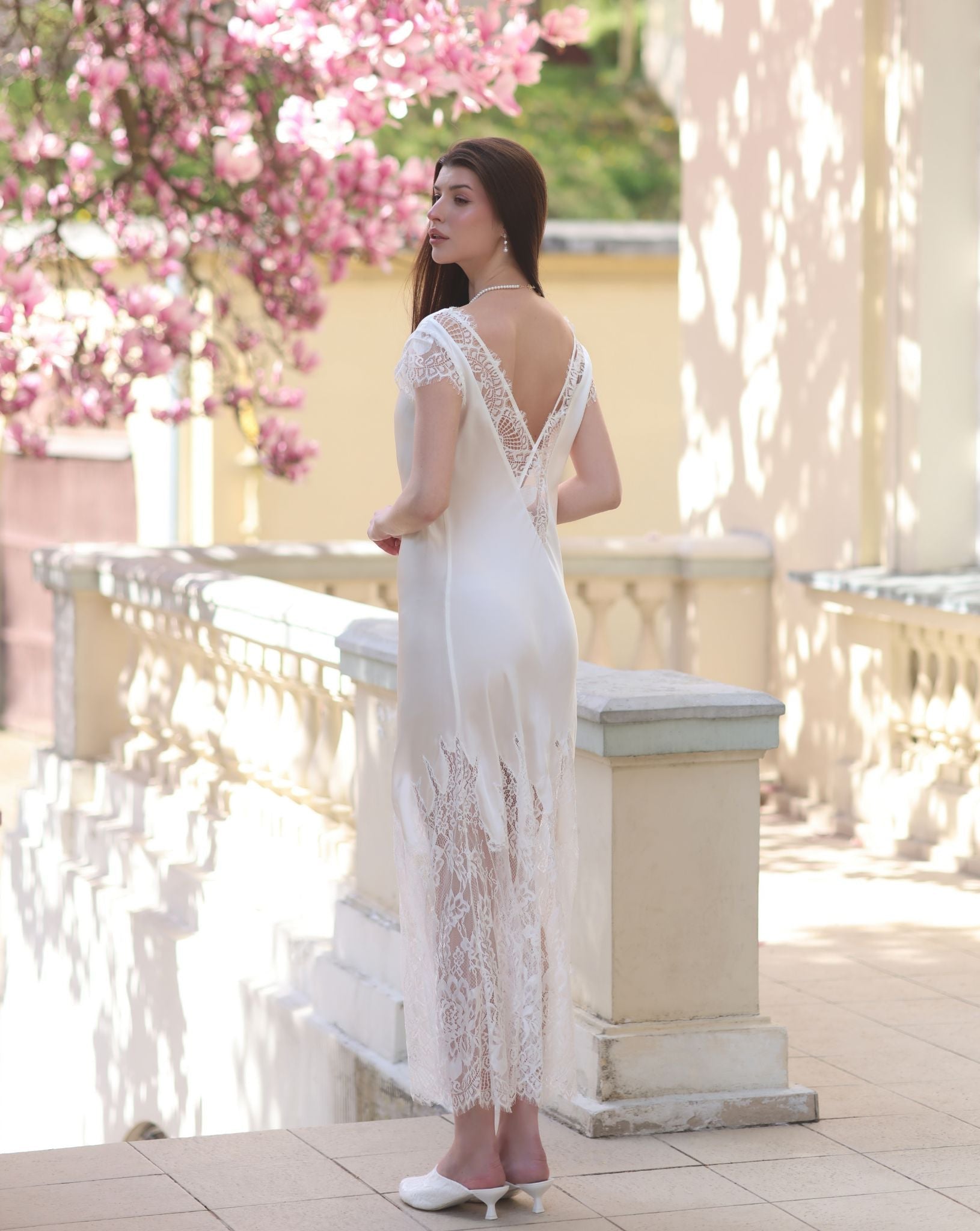 Rear view of the nightgown, showcasing the stunning lace insert and delicate cap sleeves.