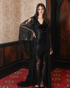 A poised, static shot of the complete ensemble, blending softness with striking detail and quiet drama.