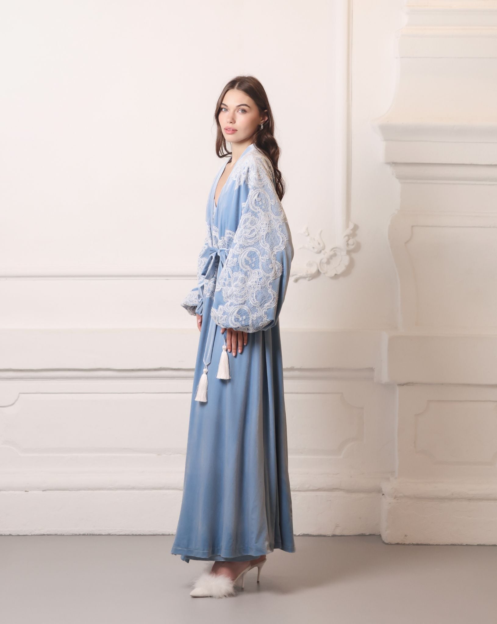 Front-side perspective of the blue velvet wrap, highlighting the soft texture and luxurious essential style.