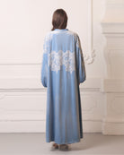 Back view of the floor-length ensemble, emphasizing the regal presence and effortless grandeur of the design.