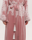 Detailed view of the voluminous balloon sleeves embellished with delicate ivory corded lace inserts.