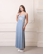 Frontal view of a blue nightgown with a flattering V-neck and ivory lace embellishments on the chest.