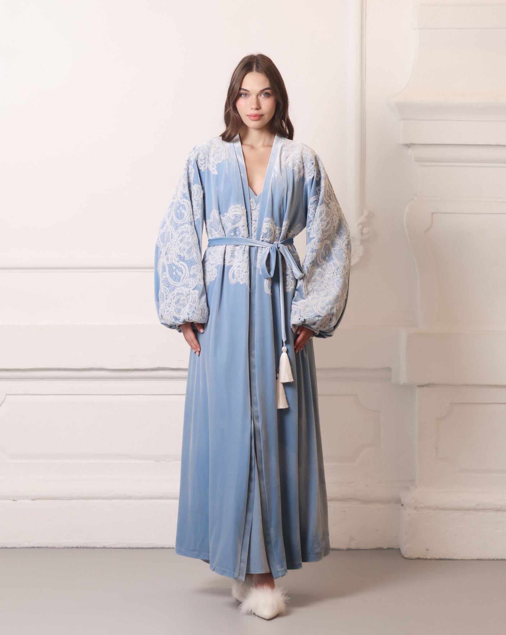 Full-length view of a plush blue ensemble featuring ivory corded lace and a sophisticated long-line design.