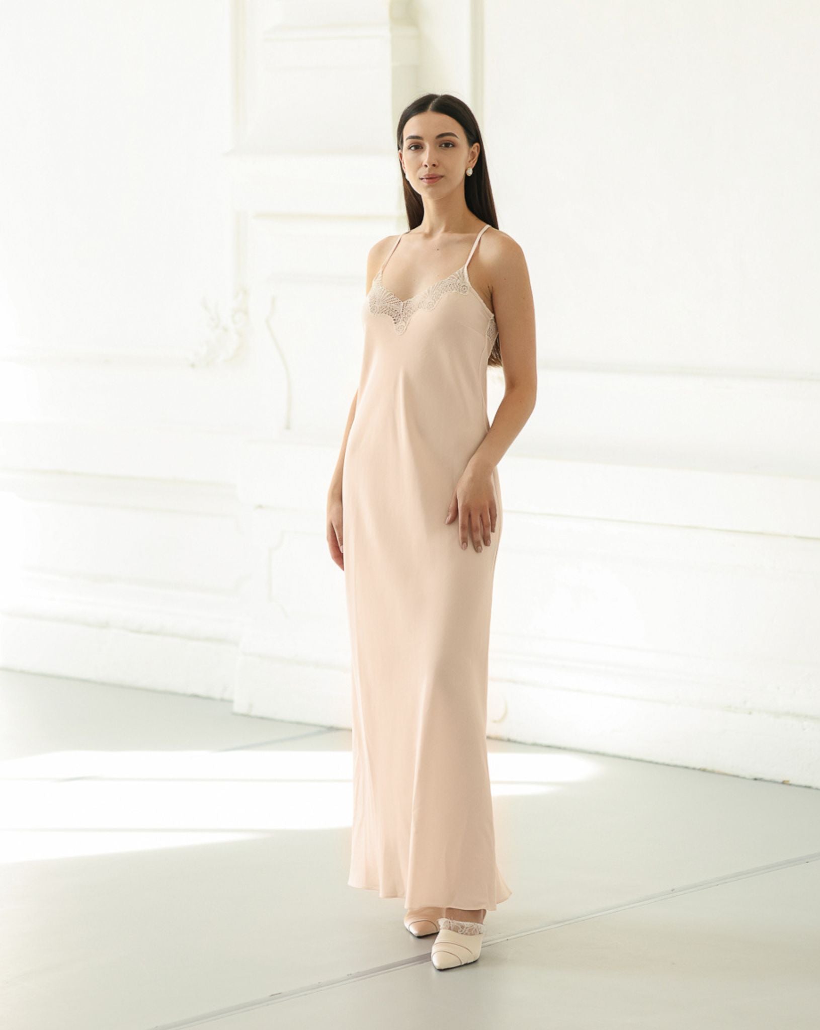 Frontal full-length view of a cotton-blend nightgown, featuring a breathable fabric and a graceful, flattering silhouette.