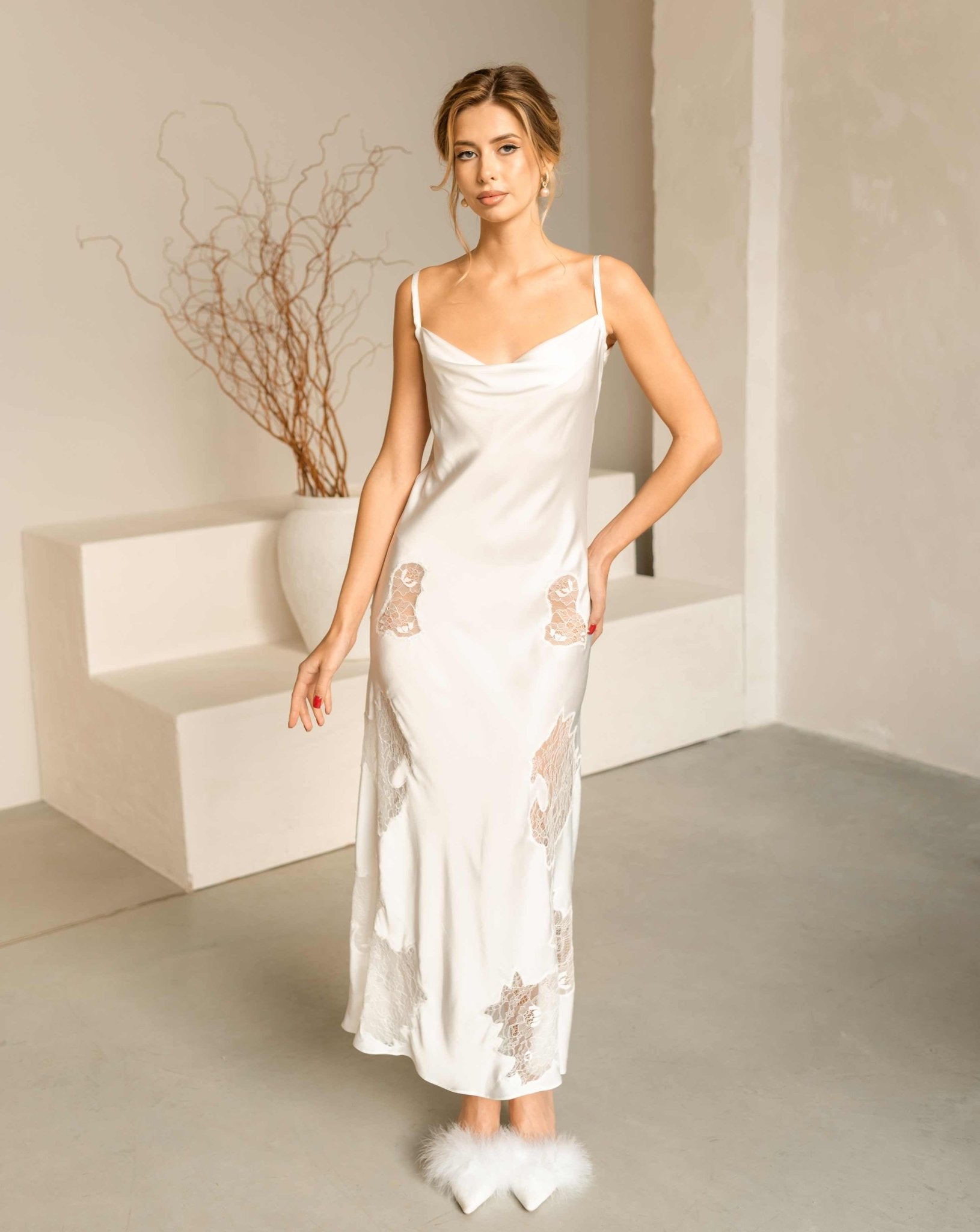 Full-length view of the white lace nightgown from the Bridal Robe and Nightgown Set, showing its feminine silhouette.