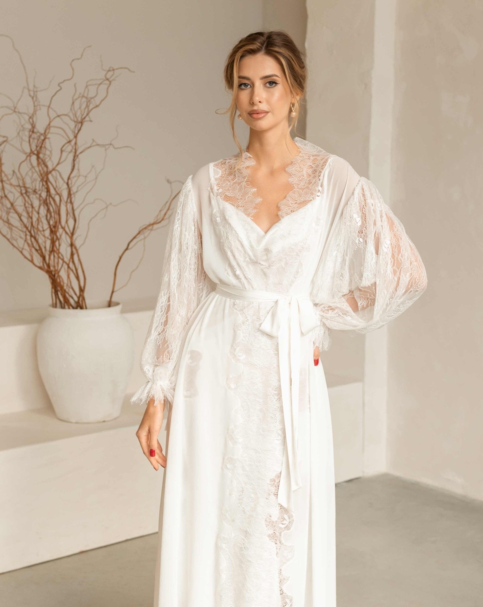 Medium shot focusing on the intricate lace details and elegant drape of the Peony bridal robe and nightgown.