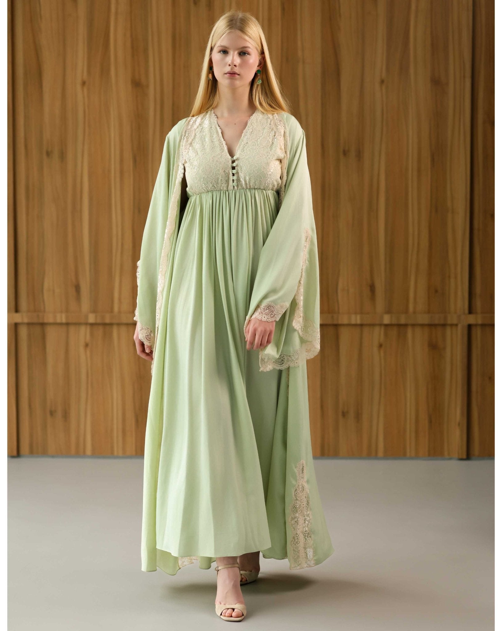 A flowing Robe and Nightgown Set in motion, showcasing the lightweight cotton-viscose blend and graceful floral lace.