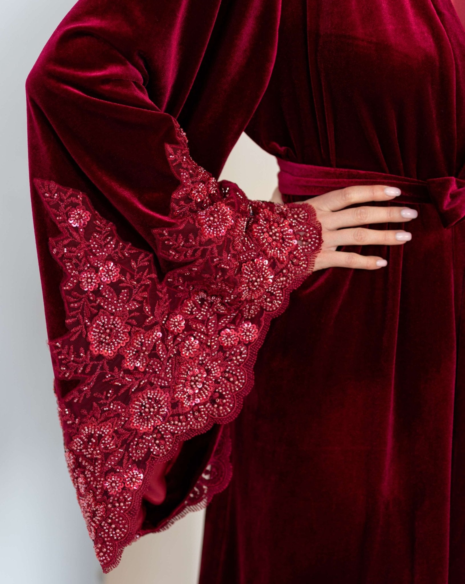 Detailed macro view of the sleeve decoration, emphasizing the firmly placed sequins and beads for a refined glow.