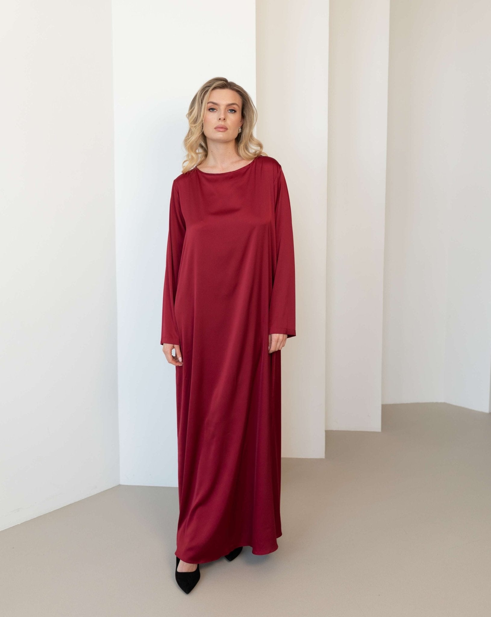 Frontal view of the thin and smooth slip dress, designed to provide comfort and a clean, minimalist silhouette.