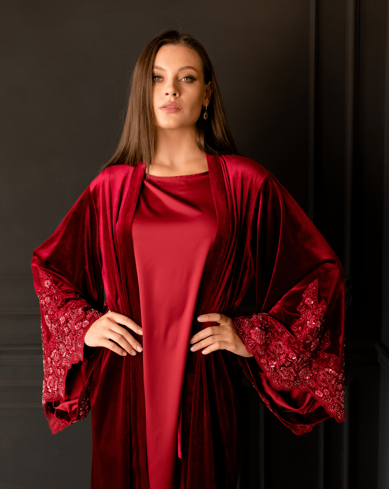 A mid-length view of the Abaya, showcasing the high-end craftsmanship and the shimmering details on the hands.