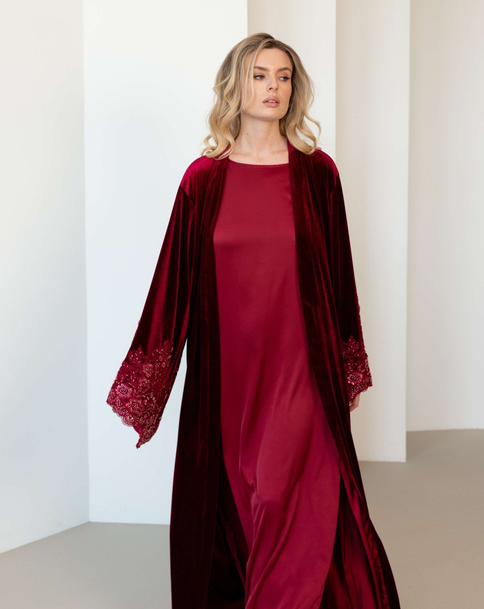 A dynamic shot of the ensemble in motion, capturing the soft shimmer of the beaded sleeves as the fabric flows.