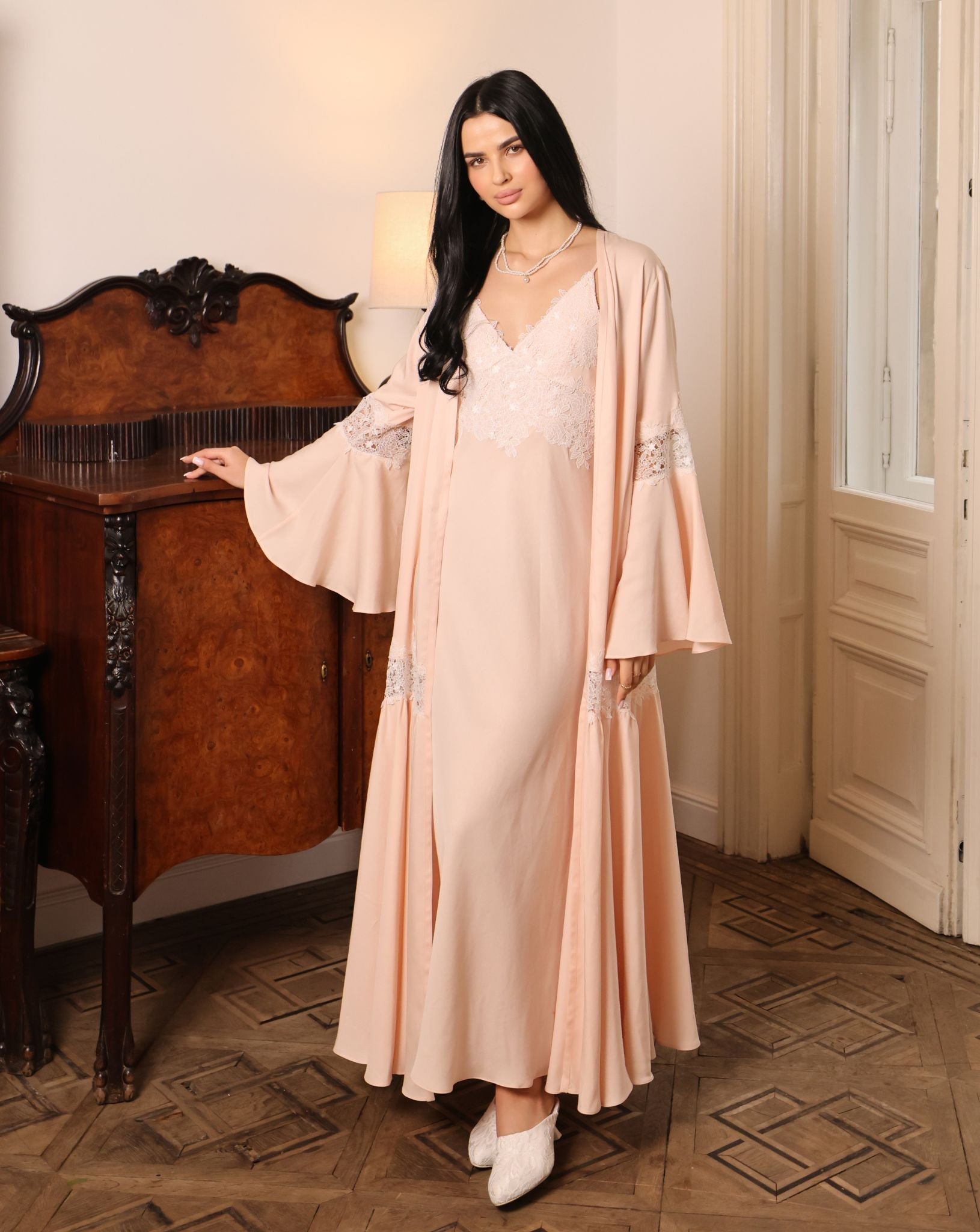 An atmospheric full-length shot of the Cotton Robe set, highlighting its serene presence and natural comfort.