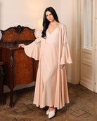 An atmospheric full-length shot of the Cotton Robe set, highlighting its serene presence and natural comfort.