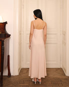 Rear view of the nightgown, showcasing the graceful drape of the breathable fabric and the elegant silhouette.