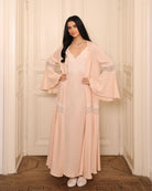 A full-height view of the Cotton Robe, emphasizing the softly flared sleeves and the feminine volume.