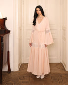 A static full-length shot capturing the refined beauty and quiet confidence of the two-piece ensemble.