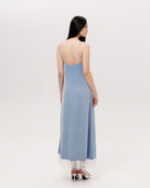 Rear view of the nightgown, highlighting the smooth drape of the velvet and the elegant length regulation.
