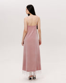 Back perspective of the long velvet gown, showing how the material follows the figure with ease and warmth.