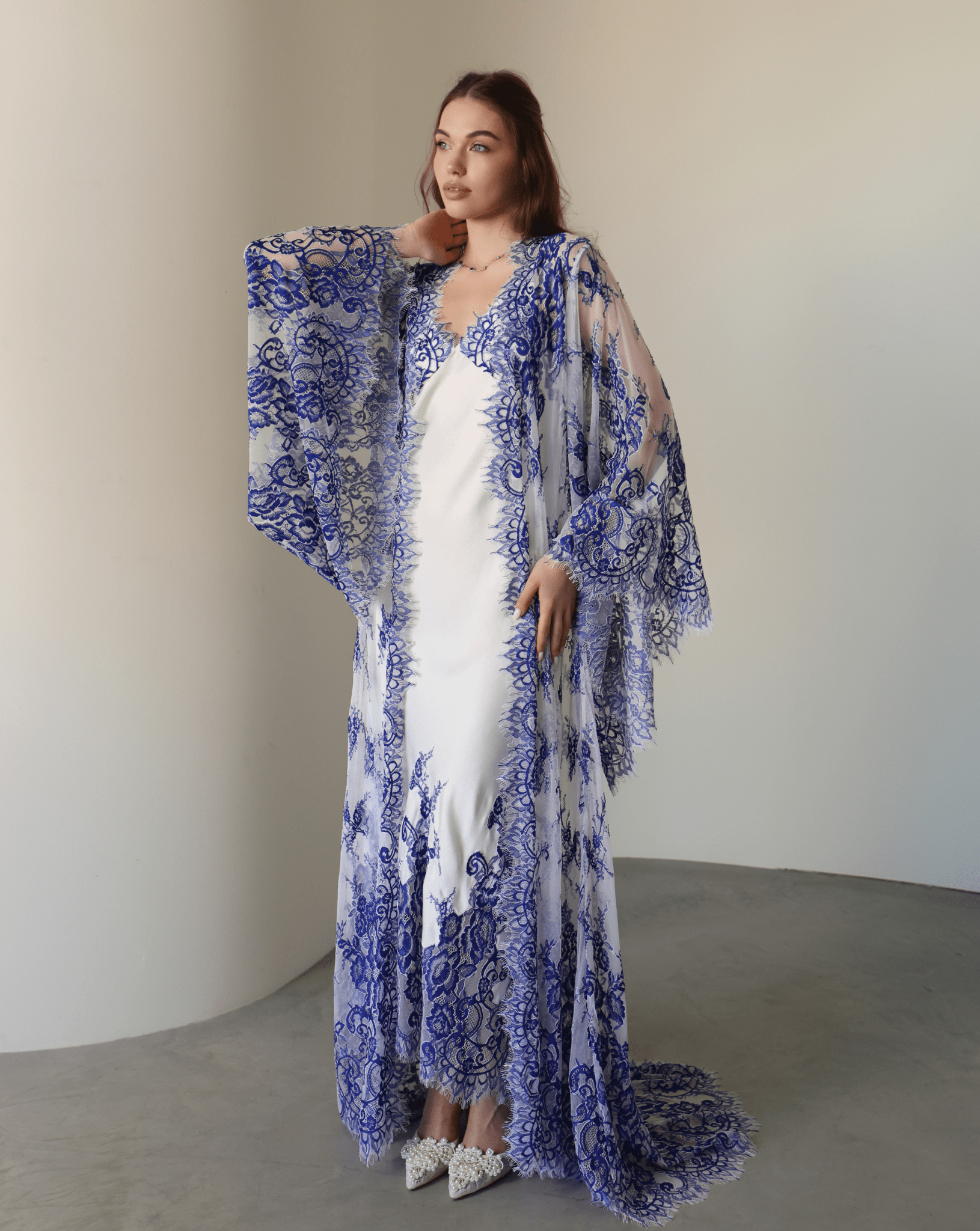 A full-length shot of the Robe and Nightgown Set, capturing the airy lace and effortless feminine style.