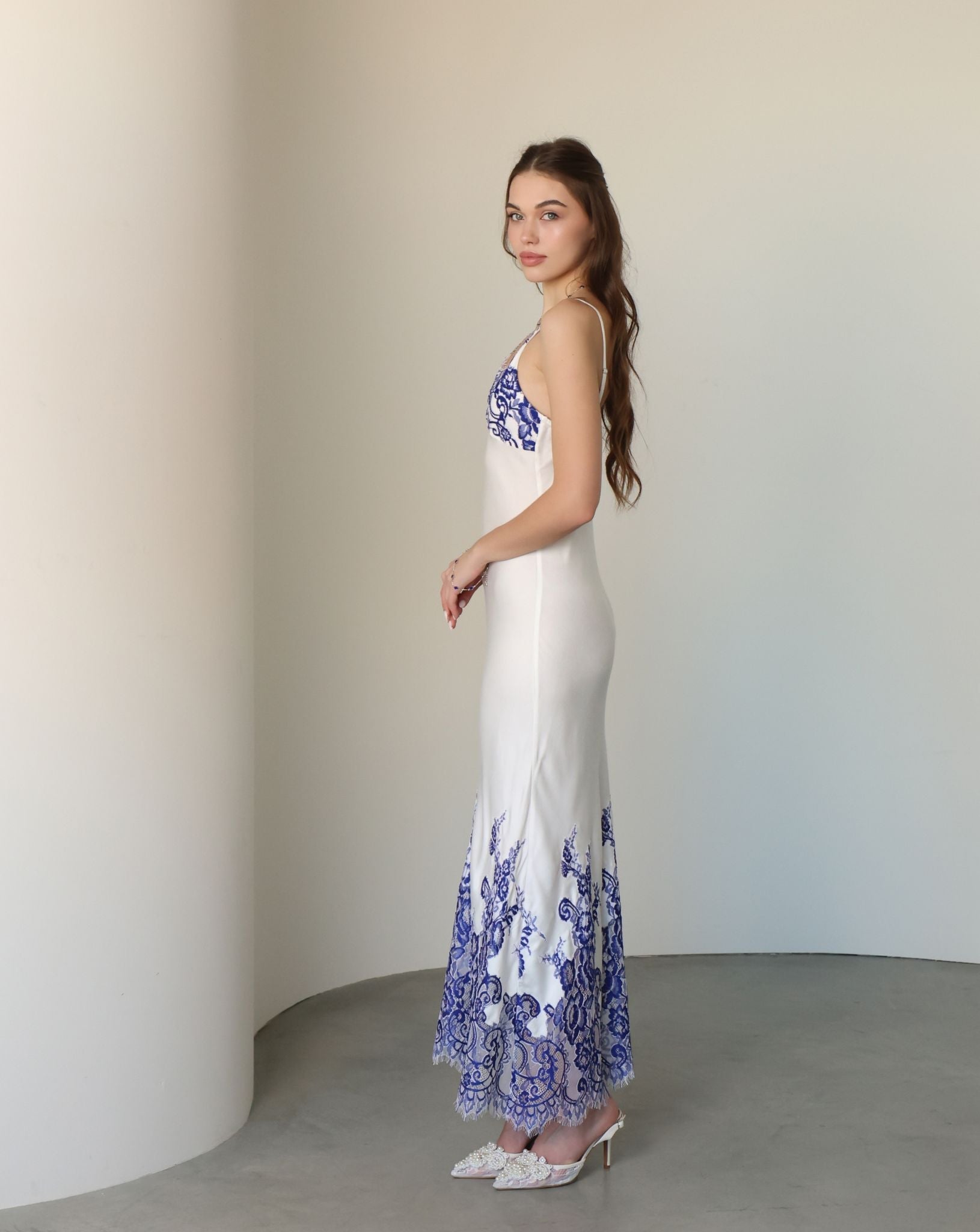 Side perspective of the sleeveless nightgown, highlighting the natural softness and simple, elegant lines.